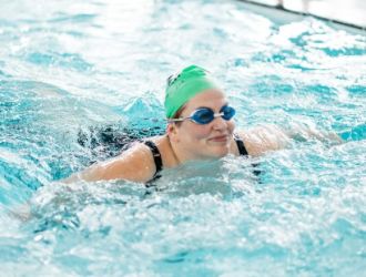 lady swimming with swim cap on lady swimming with swim cap on